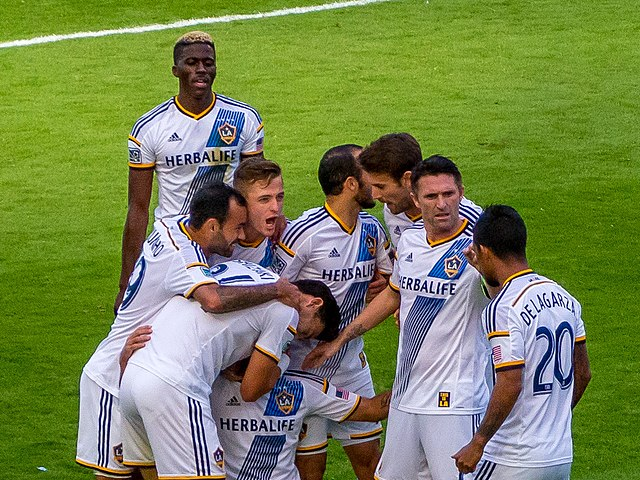 LA Galaxy celebrating after a game in 2014. Image via Wikimedia Commons.